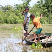 Local kids catch snail for tonight dinner 