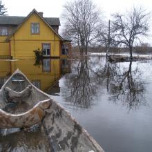 Dugout canoe is a practical vessel during flood "fifth" season.