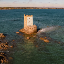 View of Seymour Tower – this was built in 1782 as a coastal defence tower and is located just inside the boundary of South East Coast of Jersey Ramsar site – the site stretches back to the coastline of Jersey island which is visible in the background