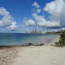 One of the turtle nesting beaches in front and the harbour area at San Nicolas in the back.